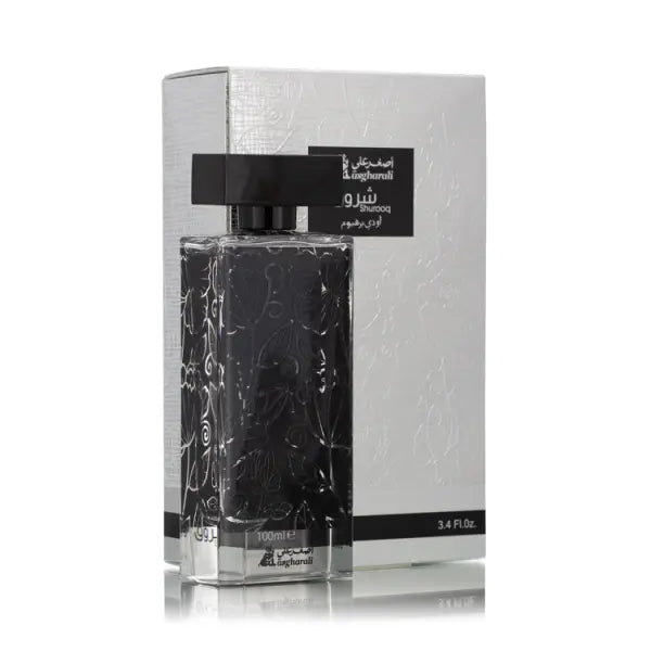 shurooq black perfume bottle with intricate design on a white background